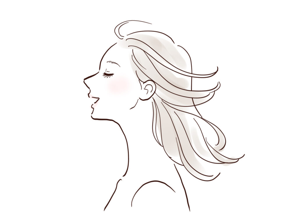 髪をなびかせる女性のイラスト
