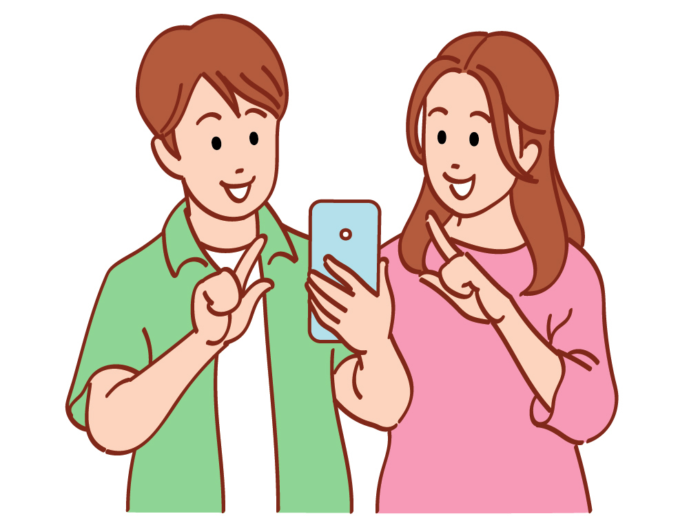 スマホを一緒に眺める男女
